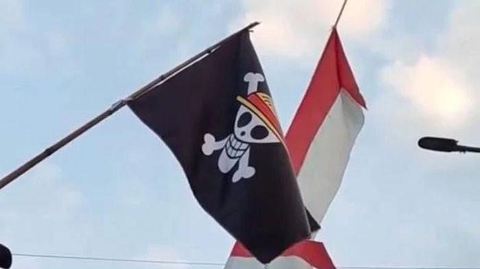 ANCAMAN DENDA - Ilustrasi bendera One Piece jelang HUT ke-80 RI. Pengibaran bendera One Piece menjelang 17 Agustus 2025 bisa mendapat sanksi penjara hingga denda, Senin (4/8/2025).