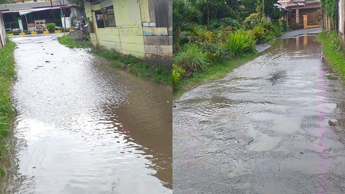TERSUMBAT: Jalan di Lorong Kampung Baru Kotamobagu terendam air. Warga keluhkan drainase tersumbat