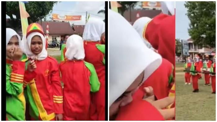 TANGIS PEMAIN DRUMBAND - Penampilan drumband dari MTs N 7 Sungai Bahar, Muaro Jambi saat HUT ke-80 Kemerdekaan RI berakir dengan isak tangis, diduga imbas kelakuan panitia yang putar musik ulang tahun saat grup drumband masih tampil.