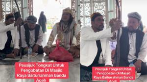 Viral-Video-3-Pria-Berbaju-Putih-Lagi-Peusijuek-Tongkat-Kesehatan-di-Masjid-Raya-Baiturrahman.jpg