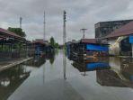 Banjir-yang-menggenangi-badan-jalan-di-pasar-harian-Singkil-Aceh-Singkil-berangsur-surut.jpg