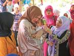 Kak-Ana-berikan-bantuan-rumah-keluarga-almarhum-Bustamam.jpg