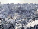 Khaberni-yang-menunjukkan-bekas-ledakan-bom-dari-serangan-udara-Israel-di-Beit-Lahia-Gaza-Utara.jpg