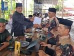 MPU-Kabupaten-Aceh-Utara-menyerahkan-dokumen-kajian-aliran-sesat.jpg