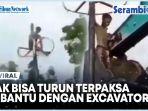 Pemanjat-Pinang-Tidak-Bisa-Turun-Terpaksa-Dibantu-Dengan-Excavator.jpg