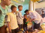 Pembina-KWPSI-Tarmizi-A-Hamid-atau-yang-akrab-disapa-Cek-Midi-memberi-santunan-anak-yatim.jpg