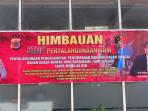 Polres-Lhokseumawe-memasang-spanduk-di-sebuah-SPBU_.jpg