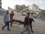Warga-Palestina-menandu-jenazah-korban-serangan-udara-Israel-di-Gaza.jpg