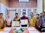 dpmg-aceh-besar-lakukan-penandatanganan-moa-dan-ia-tersebut.jpg