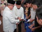 menyerahkan-santunan-kepada-25-anak-yatim-yang-berada-di-seputaran-Kota-Jantho.jpg