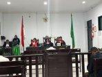 Sidang-marchelo-payong.jpg