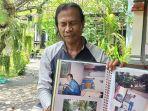 I-Nyoman-Ranten-saat-menunjukan-foto-sang-istri-Ni-Wayan-Supini-semasa-hidup.jpg