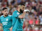 pemain-depan-real-madrid-karim-benzema-memberi-isyarat.jpg