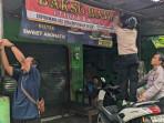 20252910-DMI-pasang-spanduk-warung-bakso-tidak-halal-di-daerah-jogya.jpg