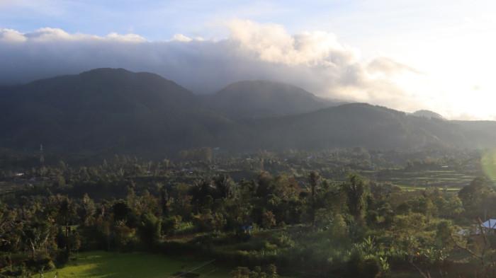 Hamparan sawah hijau dikelilingi perbukitan menjadi lanskap khas Kampung Berseri Astra