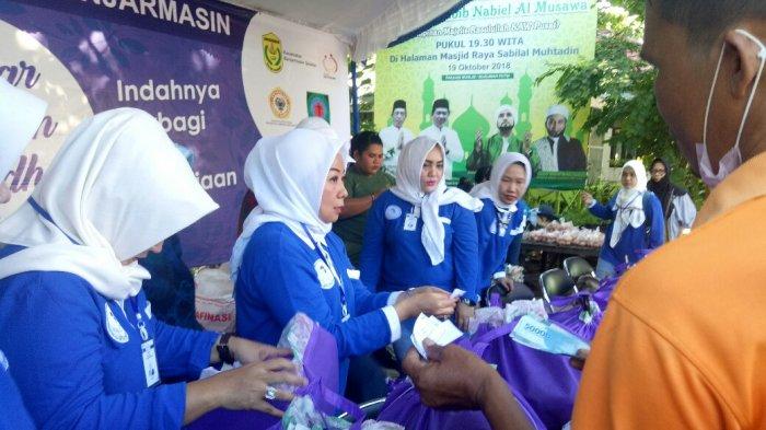 DPC Iwapi Kota Banjarmasin dan Yayasan Suaka Ananda BPost Bagikan 750 Paket Sembako Murah