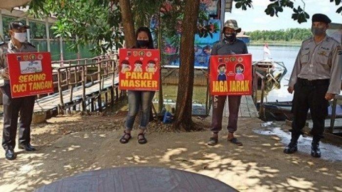 Polsek Banjarbaru Timur Sosialisasikan Protokol Kesehatan di Wisata Danau Seran
