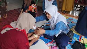 KADER-Posyandu-Desa-Nusaindah-aktif-memberikan-pelayanan-kepada-masyarakat-balita.jpg