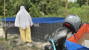 Kolam-bioflok-berisi-anakan-ikan-lele-yang-disedot-airnya-oleh-BPK.jpg