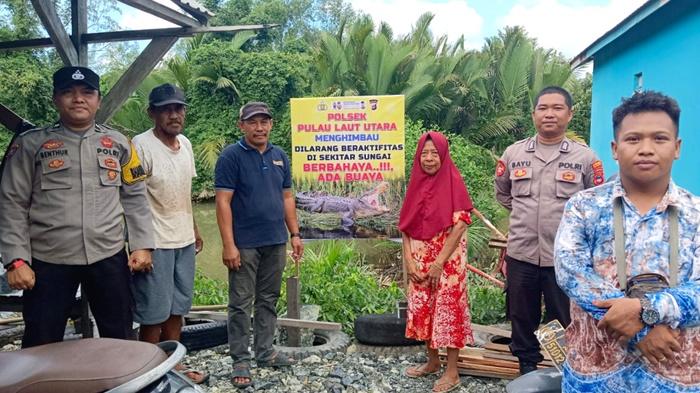 Polsek-Pulaulaut-pasang-spanduk-peringatan-buaya.jpg