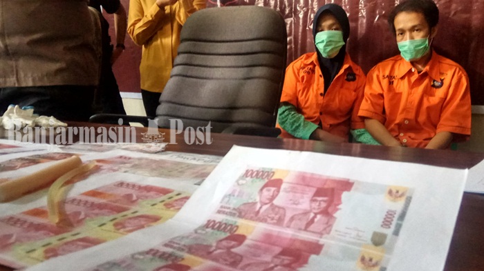pasutri-yang-jadi-pelaku-penyebaran-uang-palsu-di-hsu.jpg
