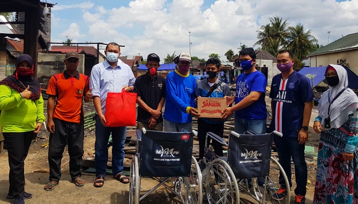 penyerahan-bantuan-kepada-musibah-kebakaran-di-cempaka.jpg