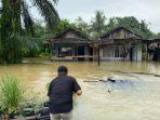 Banjir-di-Desa-Karang-Bintang-Kecamatan-Karang-Bintang-Tanbu.jpg