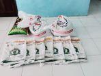 Barang-bukti-beras-Bulog-yang-sempat-ditinggalkan-pelaku-di-belakang-kantor-desa.jpg