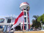 Bendera-Merah-Putih-Ukuran-Besar-Dikibarkan-di-Tower-PDAM-HSU.jpg