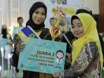Khairun-Nisa-saat-menerima-gelar-Juara-2-Putri-Duta-Genre-HSU-2022-asdf.jpg