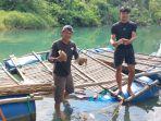 MATI-Warga-Desa-Jorong-memperlihatkan-ikan-nilas.jpg
