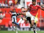 Miguel-Almiron-Raphael-Varane-Manchester-United-vs-Newcastle.jpg