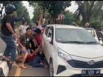 PETUGAS-kepolisian-menangkap-pelaku-kejahatan-di-traffic-light-dekat-bundaran.jpg