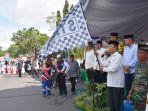 Pelaksana-Tugas-Plt-Bupati-Kapuas-Nafiah-Ibnor-melepas-peserta-Pawai-Tahun-Baru-Islam-1445-H.jpg