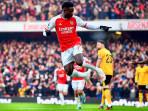 Pemain-Arsenal-Bukayo-Saka-melakukan-ekspresi-unik-usai-mencetak-gol.jpg