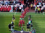 Pemain-Liverpool-memasuki-lapangan-saat-laga-melawan-Arsenal-di-Liga-Inggris.jpg