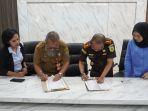 Penandatanganan-MoU-tentang-penanganan-Hukum-bidang-Datun-Kejari-Tapin.jpg