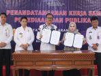 Penandatanganan-kerjasama-Kanwil-Kemenkumham-Kalsel-dengan-Banjarmasin-Post.jpg
