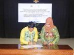 Penandatanganan-nota-kesepahaman-dan-PKS-Kanwil-Kemenkumham-kalsel-dengan-dprd-dan-pemkab.jpg