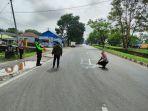 Personel-Unit-Gakkum-Satlantas-Polres-Banjarbaru-saat-melakukan-olah-TKP-di-Jalan-Lingkar-Selatan.jpg
