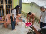 Petugas-ketika-melakukan-melakukan-penyelidikan-epidemiologi-kasus-DBD.jpg