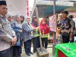 Pj-Bupati-Batola-Dinansyah-mendampingi-Menteri-PPPA.jpg