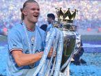 Striker-Manchester-City-Erling-Haaland-Berpose-Bersama-Trofi-Liga-Inggris.jpg