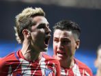 antoine-griezmann-kiri-merayakan-gol-atletico-madrid-ke-gawang-as-roma_20171123_060245.jpg