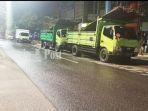 antrean-truk-di-jalan-brigjen-hasan-basri-kayutangi-banjarmasin-provinsi-kalsel-09022021.jpg