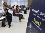 antrean-wajib-pajak-mendaaftar-program-tax-amnesty_20170213_113830.jpg