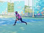 atlet-tenis-kalsel-melawan-petenis-papua-barat-di-pool-a-nomor-beregu-pon-xx-papua-2021.jpg