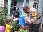 bhabinkamtibmas-desa-binjai-aipda-ferry-hermawan-tk-muara-uya-tabalong-kalsel.jpg