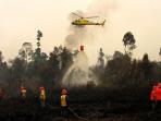 bom-air-helikopter-kebakaran-hutan_20150909_080731.jpg