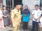 bupati-barito-selatan-h-eddy-raya-samsuri-saat-memberikan-nasehat-kepada-warga.jpg